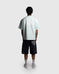 Dos t-shirt oversize Noclout vert menthe porté homme logo blanc streetwear